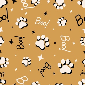 Cute Halloween Cat Paws tossed with Boo! and stars in mustard yellow for quilting and kids