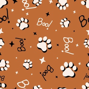 Cute Halloween Cat Paws tossed with Boo! and stars in burnt orange for quilting and kids