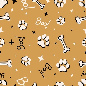 Cute Halloween Dog Paws tossed with Boo! and stars in mustard yellow for quilting and kids