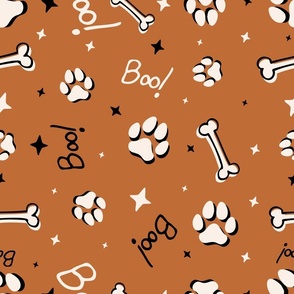 Cute Halloween Dog Paws tossed with Boo! and stars in burnt orange for quilting and kids