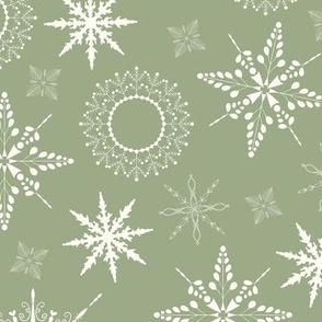 Delicate snow flakes in different sizes toss print - white on laurel green background