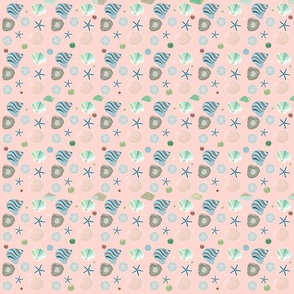Shells on a soft pink background. 
