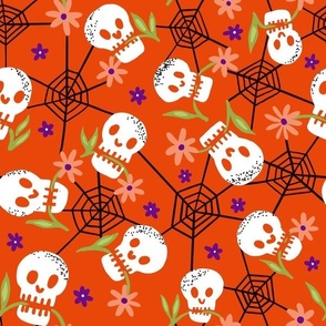 Munching Halloween skulls on pumpkin orange normal scale
