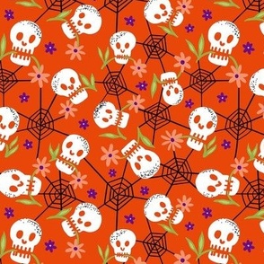 Munching Halloween skulls on pumpkin orange small scale