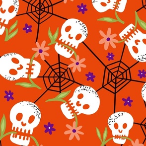 Munching Halloween skulls on pumpkin orange wallpaper scale