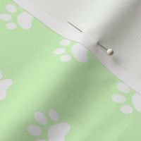 simple white cat paw prints on pastel green