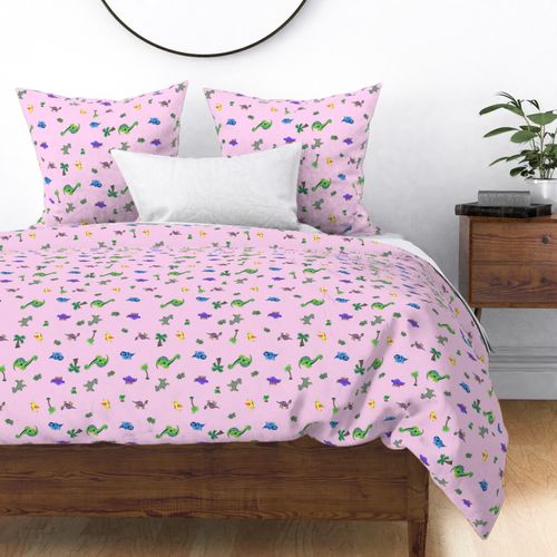 Dinosaurs scattered on light pink  - regular scale print -  (green, blue, yellow, orange, purple, lavender, gray dinosaurs) 