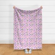 Dinosaurs scattered on light pink  - regular scale print -  (green, blue, yellow, orange, purple, lavender, gray dinosaurs) 