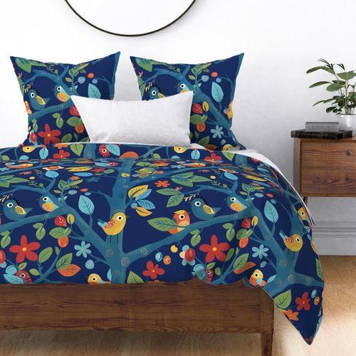 Cute birds hidden in a blue tree with colorful leaves and flowers on dark blue - large scale