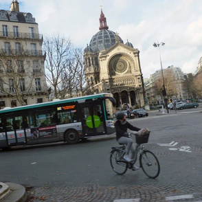 Cyclist and bus at St. Augustine, Paris