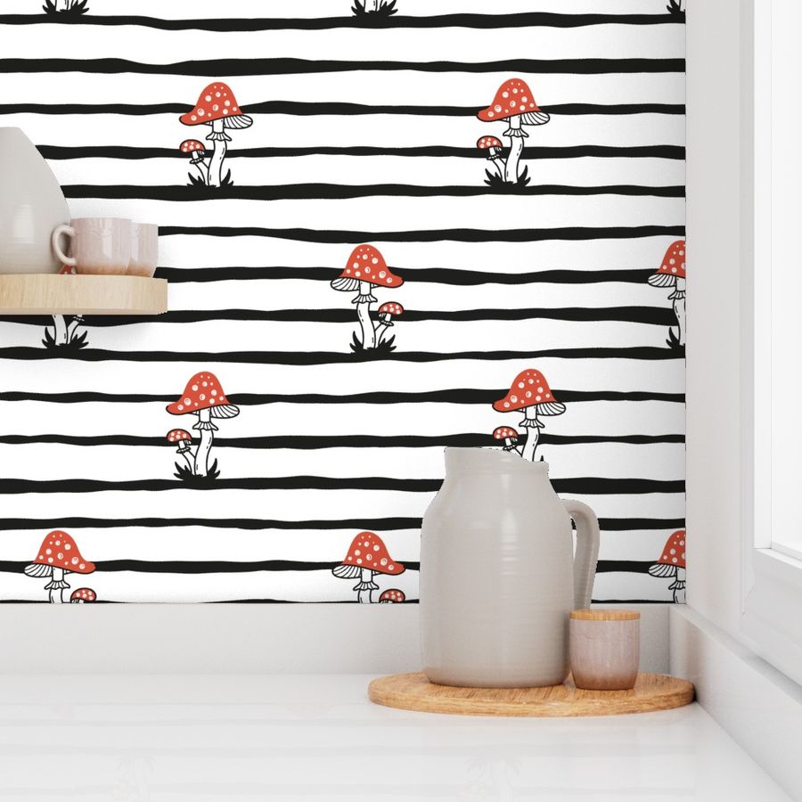 Fly agaric / Black and white striped background