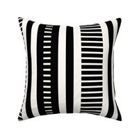 Modern varied Stripes with 1in 3in vertical stripe width in Black and white