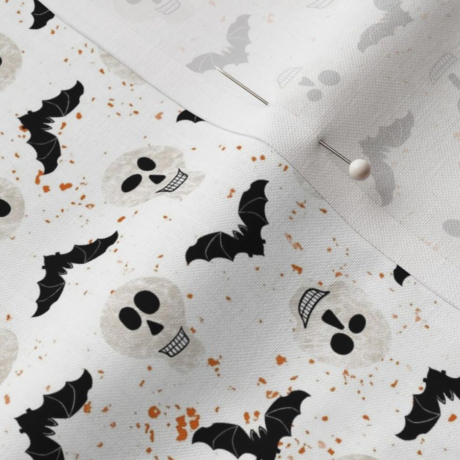 Bats and skulls on white background with orange splatter - Small