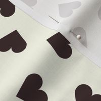 Dark chocolate hearts on cream