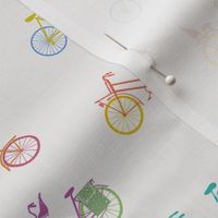 Mixed colored bicycles on offwhite