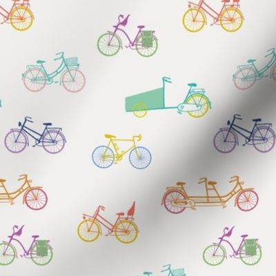 Mixed colored bicycles on offwhite