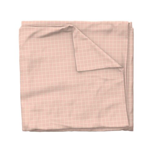 A square 1 inch grid off white on soft pink