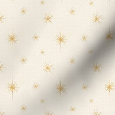 Small golden light star pattern with neutral background