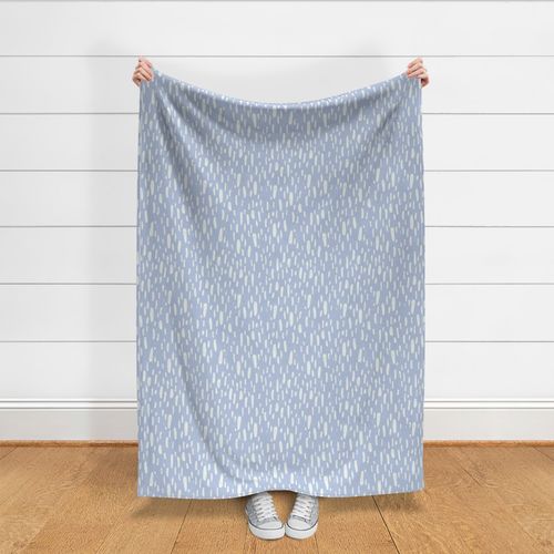 Large long narrow fawn spots block print in ecru off-white on blue