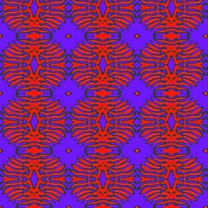 Red batik flower on blue background