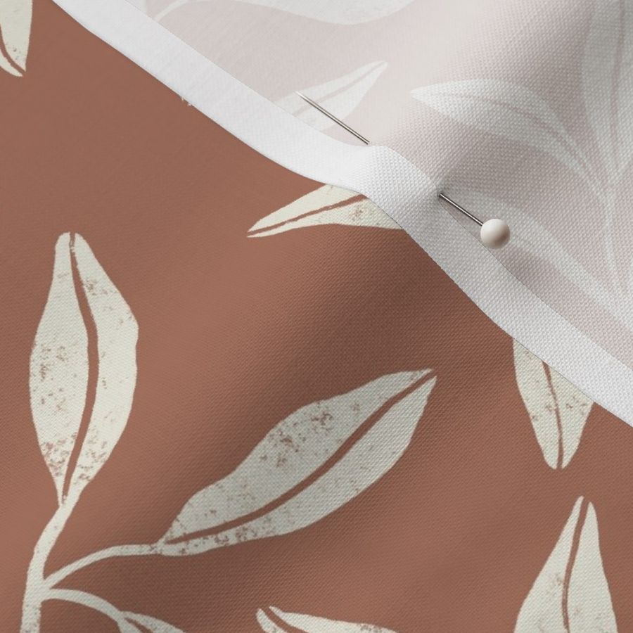 Light cream white trailing leafy vines on neutral mocha mousse background