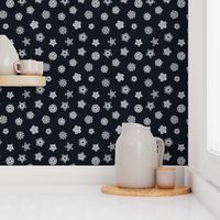 cut paper stars on dark navy