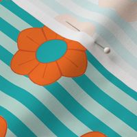 Bright orange flowers on light and dark turquoise stripes evoke a fun, retro vibe with a graphic twist.