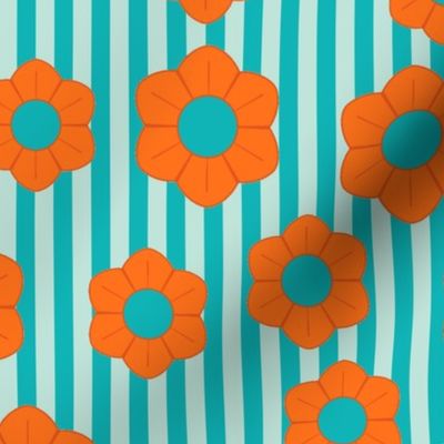 Bright orange flowers on light and dark turquoise stripes evoke a fun, retro vibe with a graphic twist.