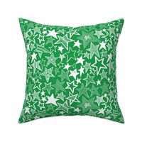 White patterned stars on green background