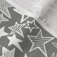 White patterned stars on grey background