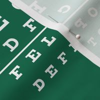 XL vision chart in white on green