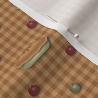green_and_red_pies_and_apples_on_tan_gingham