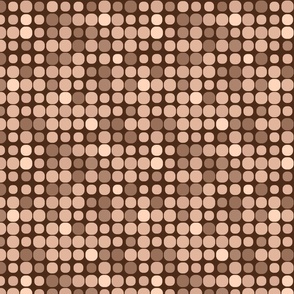 Assorted brown circles on dark background, evoking a box of truffles with a retro vibe