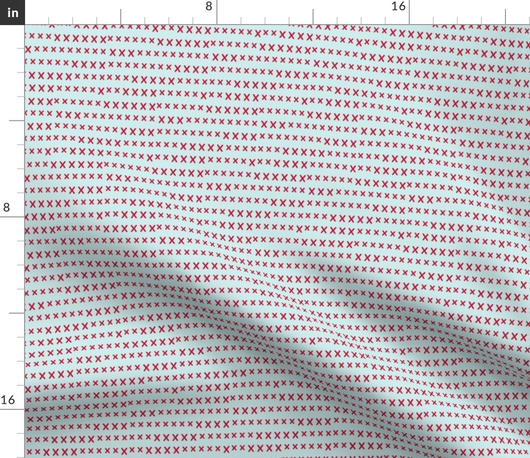 hand cross stitch red on pale blue