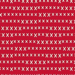 hand cross stitch on red