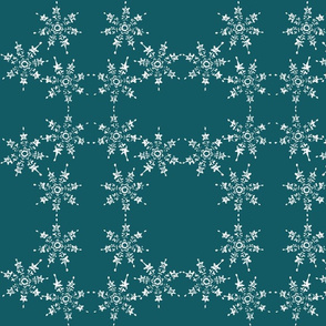 snowflake arrangemet on teal blue sky