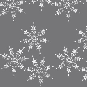 snowflake flurry on dark winter sky