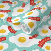 Fried egg and bacon pattern. Breakfast food design. Blue background.
