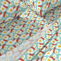 Fried egg and bacon pattern. Breakfast food design. Blue background.