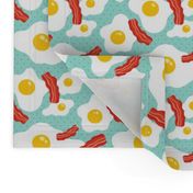 Fried egg and bacon pattern. Breakfast food design. Blue background.