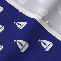 Small White Sailboats on Blue