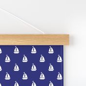 Small White Sailboats on Blue
