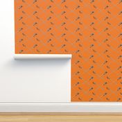 Orange Crossed Lacrosse Sticks