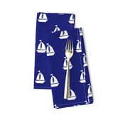 Large White Sailboats on Blue