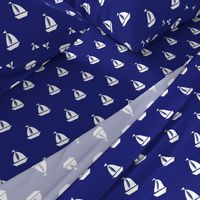 Large White Sailboats on Blue