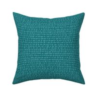 cuneiform text in teal