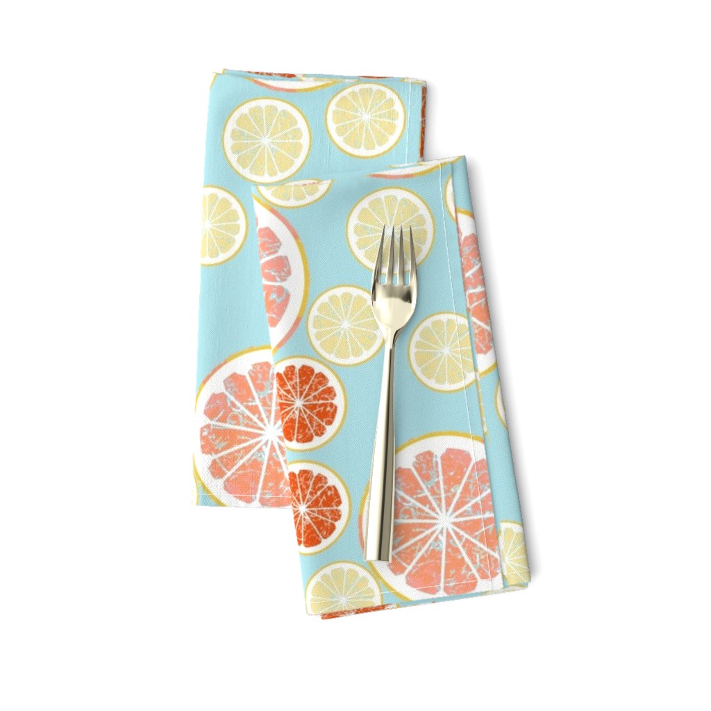 Grapefruit love - lemon, orange and grapefruit slices on blue background 