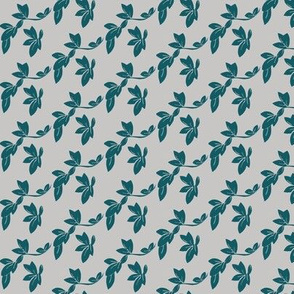 canopy of leaves in teal on a grey sky