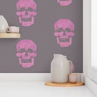 Skull in magenta-pink with mousy brown-gray background