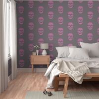 Skull in magenta-pink with mousy brown-gray background